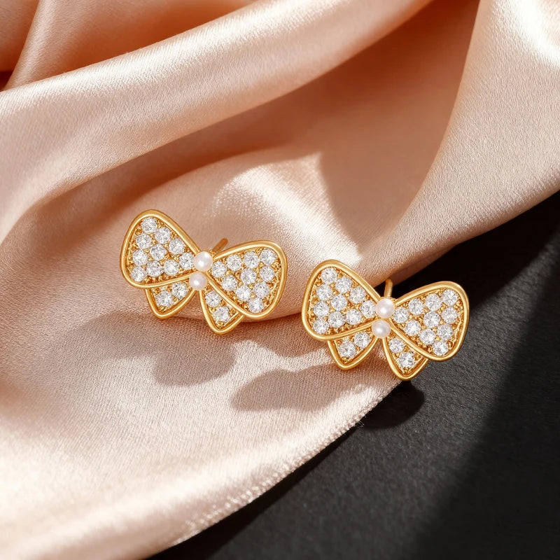 Pendientes Lazos Blancos con Dorado