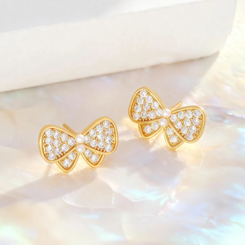 Pendientes Lazos Blancos con Dorado