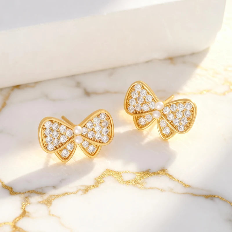 Pendientes Lazos Blancos con Dorado